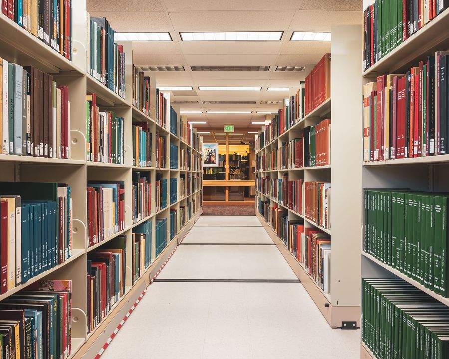 Bound journal volumes on library shelves
