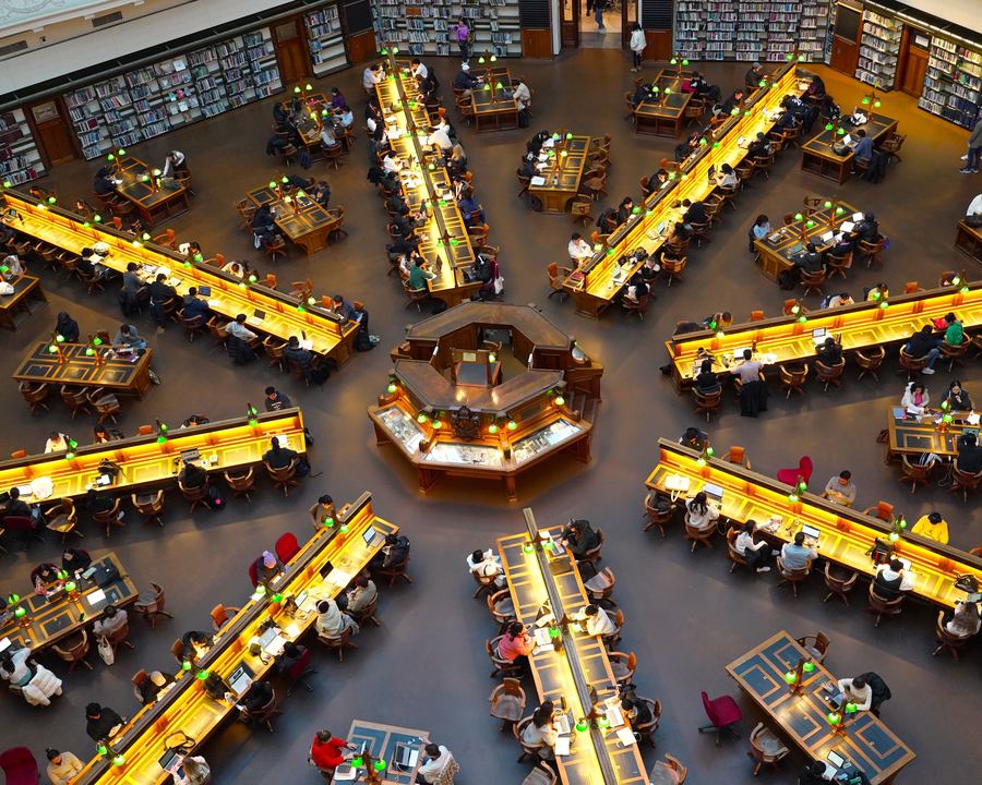 A university reading room in use, seen from above